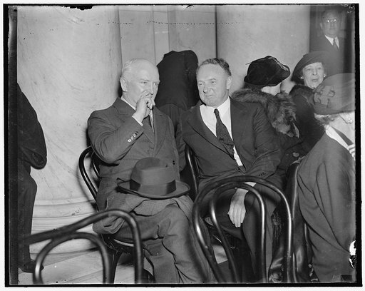 "Listening up." Washington, D.C., March 23. Joseph P. Tumulty, (left) former Secretary to the late President Wilson and now a prominent Washington attorney, "listens in" with Senator Harry Flood Byrd, of Virginia, to the opposers of the President's court reform plan before the Senate Judiciary Commi