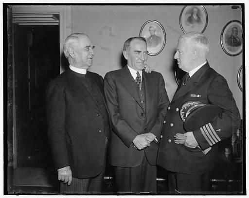 Washington, D.C., Mar. 25. Navy Chaplain opens the house with a prayer for the first time since 1820. It is the first time in 117 years that the Navy was again honored in giving the invocation. Left to right: James S. Montgomery, Chaplain of the House; Speaker William Bankhead of Ala.; and Capt. Edw