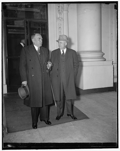 After White House sit-down strike conference. Washington, D.C., March 27. Speaker William B. Bankhead, (left) and House Majority Leader Samuel Rayburn leaving the White House today after a conference with President Roosevelt and congressional leaders on the sit-down strike crisis. The government wil