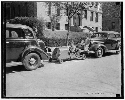 Washington youngster solves parking problem. Washington, D.C., March 30. Transportation and no parking worries. Nelm Clark, 16-year old Washington youngster, solved this problem by combining a lawn mower motor with a set of motor cycle gears to make this unusual midget auto. Costing $60 to build the