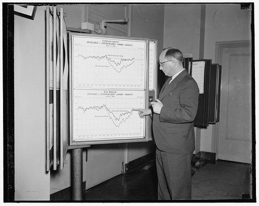 Map depicts significant story on pickup in American industry. Washington, D.C. March 30. Tow lines on this chart hanging in the office of Isador Lubin, Commissioner of Labor Statistics, U.S. Department of Labor, tell a significant story of the pickup in American Industry since 1933. Mr. Lubin points