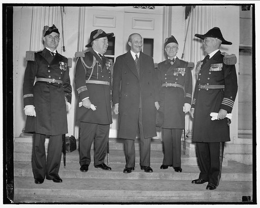 French Naval officers at White House. Washington, D.C., March 30. Officers of the French Cruiser Jeanne De Arc accompanied by the French Ambassador Georges Bonnet today paid their respects to the President at the White House. Left to right: Lt. F.M.G. Lafargue, Admiral Louis Sable, Naval Attache of 