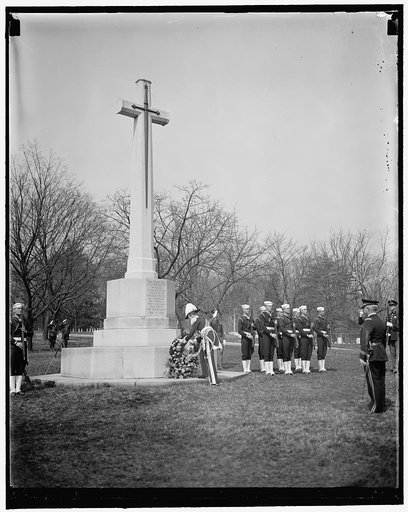 Governor General at Canadian Cross. Washington, D.C., March 31. Canada's Governor General, Lord Tweedsmuir, placing a wreath on the Canadian cross in Arlington National Cemetery today. The cross was erected by the Canadian government in honor of the American citizens who gave their lives for Canada 
