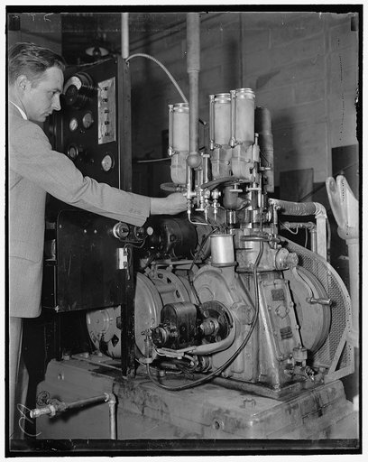 Rating gasolines at the Bureau of Standards. Washington, D.C., April 17. F.R. Carter of the U.S. Bureau of Standards is shown adjusting the mixture of gasoline to find out the rating in octane numbers of gasolines. The three carburetor shown in the foreground are each filled with a gasoline tow of w