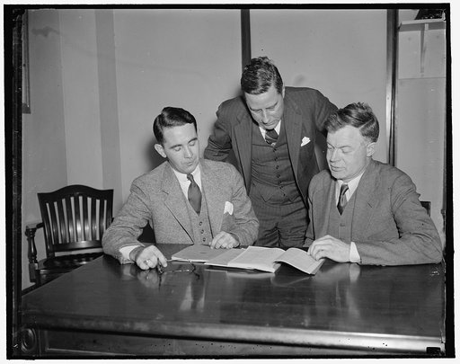 National Labor Relations Board. Washington, D.C., April 14. The National Labor Relations Board pouring over some of their problems left to right: Wakefield Smith, Edwin S. Smith, and the Chairman J. Warren Madden, 4/14/1937