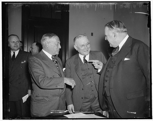 A.F. of L. Head endorses Wagner Housing Bill. Washington, D.C., April 14. President William Green of the A.F. of L. discusses various phases of the Wagner $1,040,000,000 Housing Bill with Senator Robert F. Wagner (left) author of the bill, and Senator David [...] Walsh, Chairman of the Senate Subcom