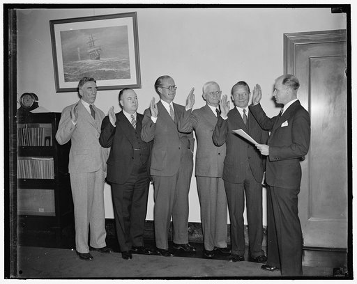 Permanent Maritime Commission sworn-in. Washington, D.C., April 14. The permanent five-man Maritime Commission as sworn-in this morning after confirmation by the Senate yesterday. Left to right at the ceremony: Thomas M. Woodward of Penna., Edward C. Moran, Jr., of Me., Chairman of the Commission Jo
