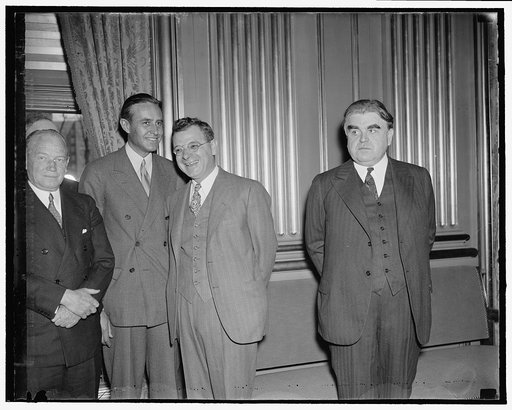 In spotlight at Labor-Industry Conference. Washington, D.C., April 20. Prominent labor and industrial leaders from all over the country attended a conference today with Secretary of Labor Perkins in efforts to agree on a national policy to avert strikes. Here we see, left to right: Averill Harriman,