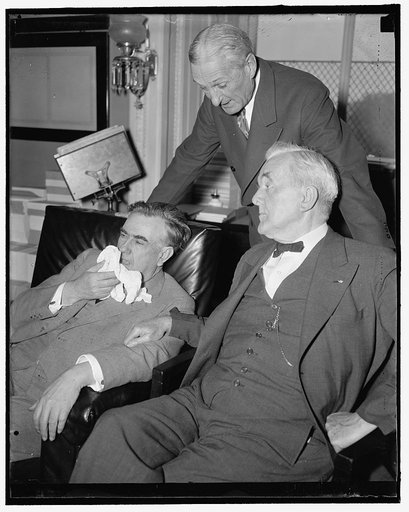 Senatorial trio. Washington, D.C., May 15. Like mailmen taking a walk on their day off, these powerful Senate figures were snapped while "listening in" on the Senate Judiciary hearing. Left to right: Senator M.M. Logan of Kentucky; Senator William Gibbs McAdoo of California; and Senator George W. No
