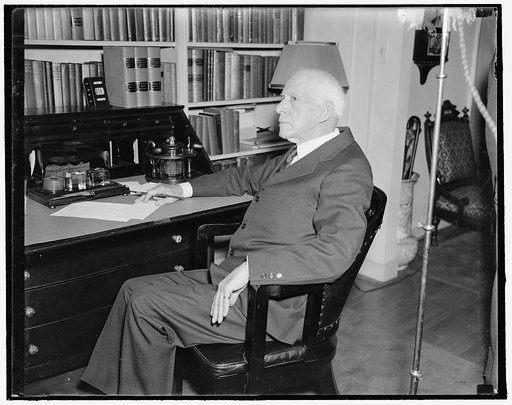 Justice Van Devanter retires. Washington, D.C., May 19th. Justice Willis Van Devanter, after 26 years of service with the Supreme Court sent his resignation to the President to become effective June 2nd, seldom photographed the judge let news photographer snap him while cleaning up his desk