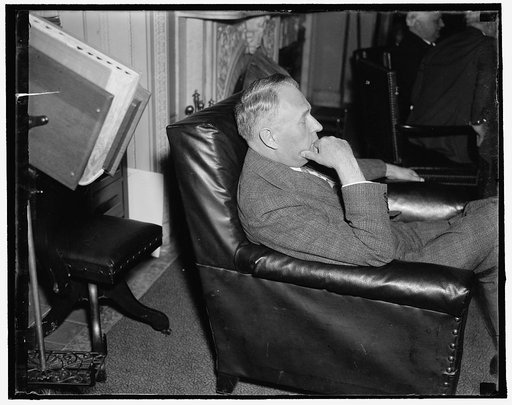 Oregon Solon. Washington, D.C., May 24. United States Senator Frederick Steiwer, Republican from Oregon, pictured as he "listened in" on a Senate hearing today, 5/24/1937