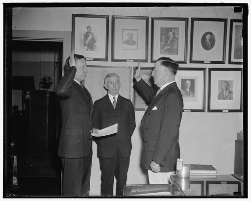New Chief of Bureau of Insular Affairs takes oath of office. Washington, D.C., May 24. Brig. Gen. Charles Burnett was today sworn in as Chief of the Bureau of Insular Affairs to succeed Brig. Gen. Creed F. Cox. In the photograph, left to right: Col. A.W. Gullion, Acting Judge Advocate General who ad