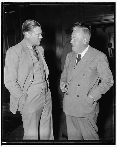 Discuss lighter than air transportation. Washington, D.C., May 25. Dr. Hugo Eckner, Germany's dirigible expert and former commander of the ill-fated Hindenburg, exchanging views on commercial aviation with Fred W. Fagg, Jr., youthful Director of the Bureau of Air Commerce, Department of Commerce. Dr
