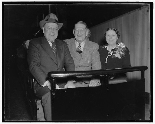 On way to opening of special session. Washington, D.C., Nov. 15. Apparently happy to get back to work these three senators, left to right: Senator Warren R. Austin of Vermont, Senator Herbert E. Hitchcock of South Dakota, and Senator Hattie Caraway, ride the senate subway on their way to the special
