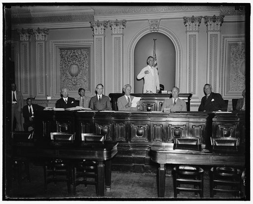 Will run senate machine while Vice President Garner is absent. Washington, D.C. June 14. While Vice President Garner is vacationing in Texas during the next few weeks, Senator Key Pittman, President Pro Tem will preside over the Senate. Senator Pittman is shown with other officers of the Senate as t