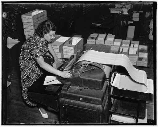 Baltimore, MD. Every individual Social Security Account is listed in several ways in the Social Security Board Records Office. The photograph above shows a Records Office worker at a machine which is listing in numerical sequence on a loose leaf ledger page a record of account numbers issued, to who