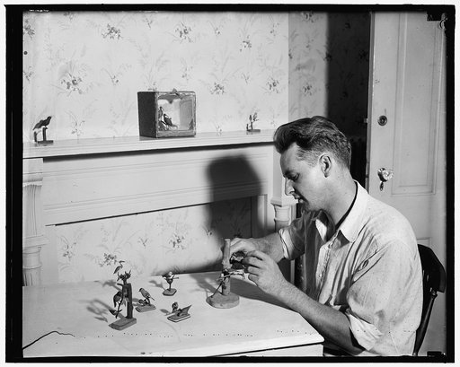 Carving birds from is hobby of Washingtonian. Washington, D.C., June 25. Using only a common jackknife as a tool, Ellis Miller, has become an expert at whittling birds from wood. Mr. Miller, a mechanic by profession, acquired his hobby through the game of Monopoly. Trying his hand at the game, he li