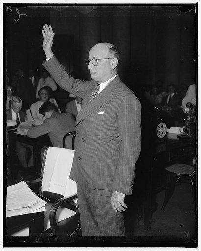 Girdler takes oath. Washington, D.C., June 24. Tom Girdler, Board Chairman of the Republic Steel Corporation, being sworn in as he took the stand today before the Senate Post Office Committee to describe his company's troubles with John L. Lewis C.I.O., 6/24/37