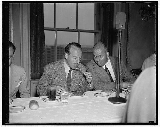 Belgian Premier lunches with newsmen. Washington D.C. June 25. The Premier of Belgium, Dr. Paul Van Zeeland, was luncheon guest of the National Press Club today. He is shown with Charles O. Gridley, (right) President of the club, 6/25/37