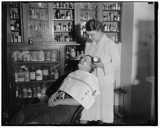 Testing cosmetics. Washington D.C. July 10. The department of Agriculture is making tests everyday in order to get cosmetics under the Pure Food and Drug Act, Mrs. C.W. West seated is helping Mrs. R. Goodman make a test on cold cream and other facial creams.