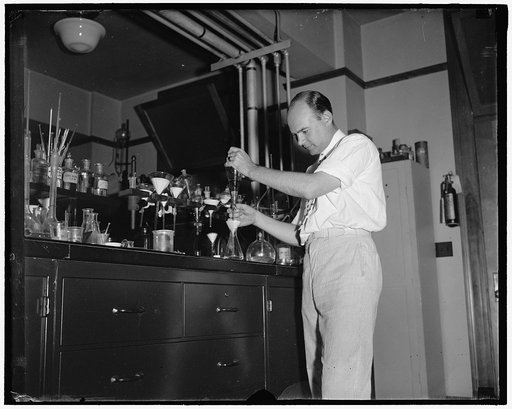 Testing cosmetics at Department of Agriculture Washington D.C. July 10. Dr. D.C. Grove, of the Dept. of Agriculture is shown giving a shakedown test of different creams to get the fattening material from the product [...