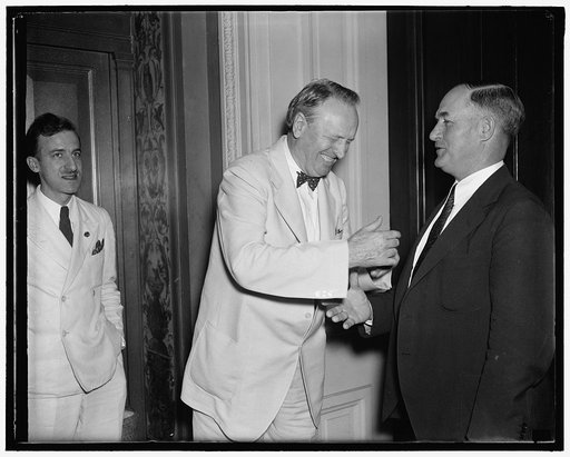 For and against. Washington D.C., July 22. Senator Henry F. Ashurst, (left) Chairman of the Senate Judiciary Committee and a strong adherent of the President's Court Reorganization Bill, greets Senator Edward R. Burke, who is leading the bloc of Democratic Senators opposing the bill, as he arrives t