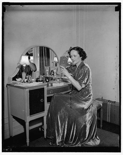 Washington D.C. July 27. One of the most beautiful of the Senate Ladies, Mrs. Claude Pepper, Wife of the Senator from Florida , needs little artificial makeup to enhance her beauty. She is shown at her dressing table getting ready for a Washington social affair. 7/27/37