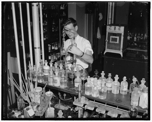 Cosmetics tested at Department of Agriculture. Washington D.C., July 10. In hair dyes and hair tonics there is sometimes found lead acetate, this is absorbed slowly into the system where it accumulates and may result in chronic poisoning. D.H. McCarter, of the Department of Agriculture is shown dete