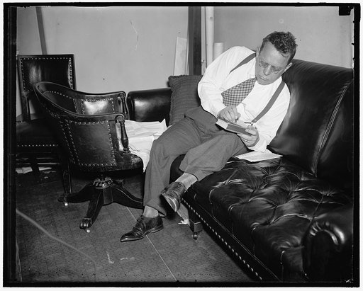 Texas Solon believes in comfort. Washington, D.C., July 30. Rep. Maury Maverick, Democrat of Texas, combats the Washington weather by shedding his coat while working in his office on Capitol Hill. Just now the fiery Texan is advocating a sweeping investigation of the entire government relief set-up.