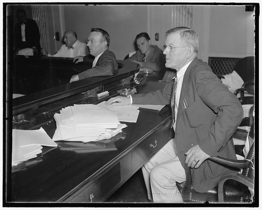 Wyoming Senator. Washington, D.C., July 30. Democratic Senator H.H. Schwartz, of Wyoming, pictured as he "listened in" at a recent Senate hearing, 7/30/37