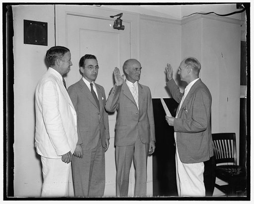 Takes oath of office as member of Social Security board. Washington, D.C., Aug. 9. George E. Bigge, of Providence, Rhode Island, today taking the oath of office as a member of the Social Security Board to succeed the former Chairman John J. Winant. A former professor of economics at Brown University
