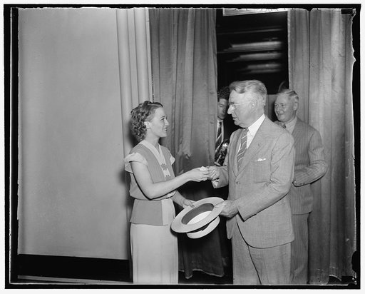 Conspicious guest at democratic harmony dinner. Washington, D.C., Aug. 11. New York Senator Royal Copeland, who just a few days ago accused President Roosevelt of destroying party harmony, arriving at the Raleigh Hotel to attend the Congressional Harmony Dinner last nght. He is shown checking his ha