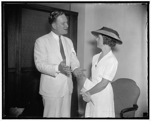Youngest Republican committeewoman gets a few tips from G.O.P. Chairman. Washington, D.C., Aug. 11. 27 years old and the youngest woman member of the Republican National Committee, Mrs. Pearl Wates of Alabama gets a few political pointers from G.O.P. Chairman John Hamilton. Mrs. Wates is in the Capi