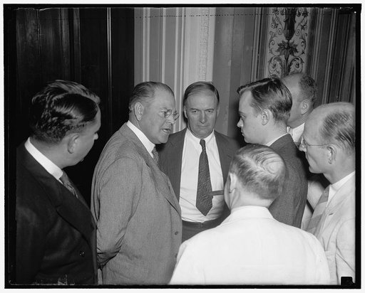 Black nomination approved by 13 to 4. Washington, D.C., Aug. 16. Senator Warren Austin of VT, left; and Senator Edward Burke, of Neb., right; talking with reporters after demanding Sen. Black of Ala. be questioned about his qualifications concerning the Supreme Court, the decisive vote came when Aus