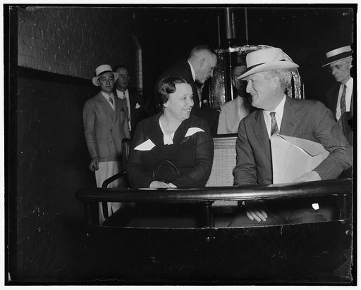 On way to Senate debate on Senator Black. Washington, D.C., Aug. 17. Senator Hattie Caraway, (left) of Arkansas, and Senator Morris Sheppard, of Texas, ride the tram car through the Senate subway on the way to attend today's Senate debate on the nomination of Senator Black as a Supreme Court Justice