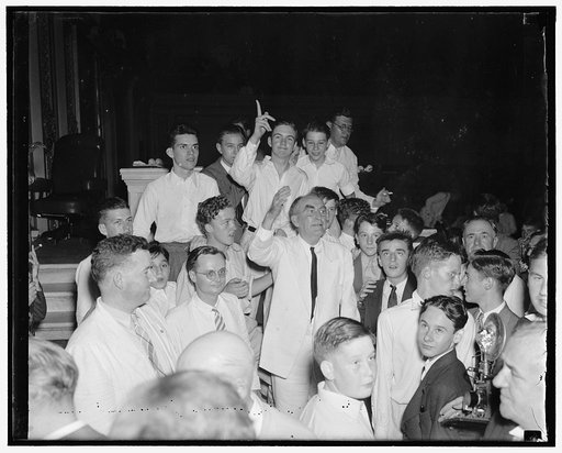 Speaker joins pages in celebrating. Washington D.C. Aug 21. Speaker Bankhead (center) joins the hilarious pages in celebrating the adjournment of the 75th Congress tonight, 8/21/37