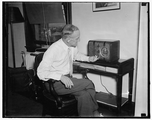 New F.C.C. Chairman "listens in." Washington, D.C., Aug. 27. Frank R. McNinch, New Chairman of the Federal Communication Commission, has become a rabid radio listener since his appointment to the post by President Roosevelt. He is show dialing in one of his favorite programs on his office set, 8/27/