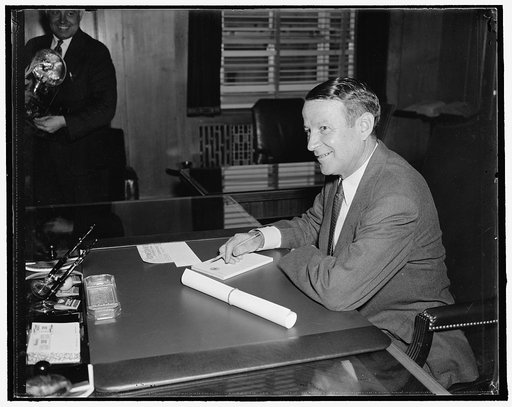 New Special Assistant to Attorney General. Washington, D.C., Aug. 30. Vincent M. Miles, newly appointed Special Assistant to the Attorney General, is shown at his desk shortly after taking the oath of office. He is a former member of the Social Security Board, 8/30/37