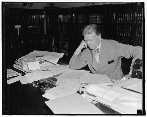 Senator Borah stays on job. Washington, D.C. Aug. 30. While other senators are resting in their home states or visiting vacation spots, Senator William E. Borah, veteran Idaho legislator, remains in Washington and goes to his office every day. He is shown reading his morning mail. 8/30/27
