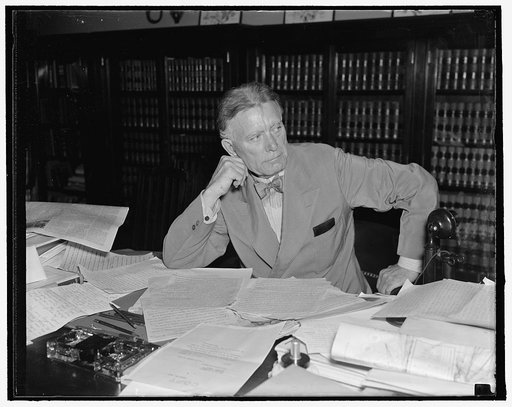 Senator Borah stays on job. Washington, D.C. Aug. 30. While other senators are resting in their home states or visiting vacation spots, Senator William E. Borah, veteran Idaho legislator, remains in Washington and goes to his office every day. He is shown reading his morning mail. 8/30/27