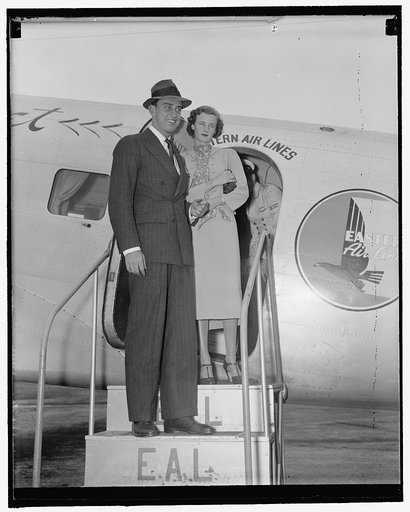 Franklin D., Jr., back with bride. Washington, D.C., Sept. 11. Franklin D. Roosevelt, Jr., and his bride, the former Miss Ethel Dupont, as they arrived at Washington Airport today on their way to Jacksonville, Florida. Rumors have it that they are on their way to attend a wedding, when questioned ab