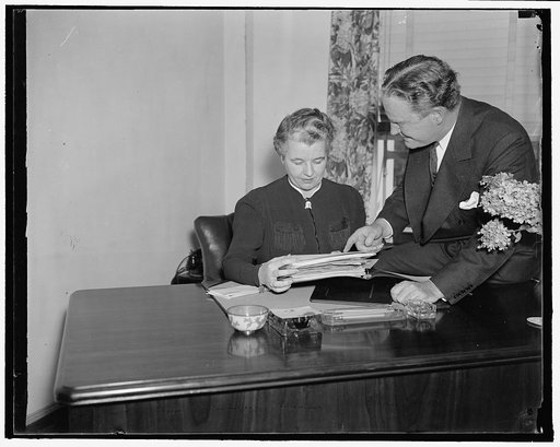 Heads of the National Republican Committee. Washington, D.C., Sept. 23. John Hamilton, Chairman of the National Republican Party, (right) confers with Miss Marion E. Martin of Bangor, ME. Who has recently been appointed Assistant to the Chairman in charge of Women's Activities of the Republican Nati