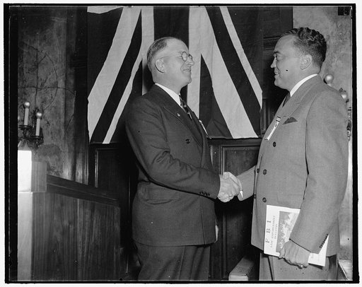 Chief of G-men greeted at identification convention. Washington, D.C., Sept. 29. J. Edgar Hoover, (right) Director of The Federal Bureau of Investigation, is greeted by Arthur Muchow, President of the International Association for Identification, as he arrived at the Willard Hotel today to welcome D