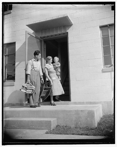 Mr. and Mrs. Irving Machiz, with their son, Edward, moving into their new quarters at Greenbelt, Resettlement Administration city, 10/2/37