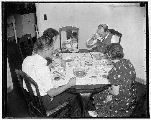 First family to settle in Greenbelt. Washington, D.C. The first family to move in and get settled in Greenbelt, MD, the, Resettlement Administration city, is Mr. and Mrs. J.M. Ashley, with their children, Lynn, 18 yrs, Dorma 16 yrs and Eddie, 4 years old. The Ashley Family are shown having the first