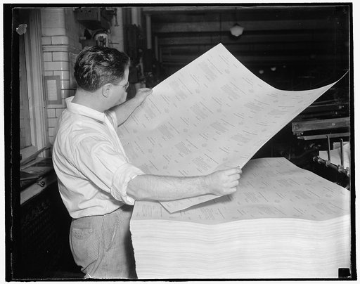 Inspects unemployment questionnaire as it comes off the press. Washington, D.C., Oct. 7. A pressman frequently inspects the sheets of unemployment census blanks as they come off the press at the Government Printing office. 3,000,000 of the questionnaires are being printed daily at Uncle Sam's big pr