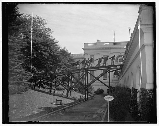 White House shrubbery transplanted. Washington, D.C., Oct. 20. Workmen are busy these days transplanting shrubbery from one section to another of the White House grounds. Here we see a crew pulling one of the huge boxes to west roof garden of the Executive Mansion. 10/20/37