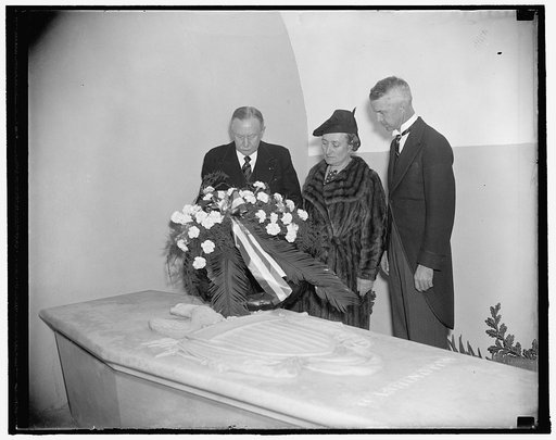 International Rotary chief pays tribute to father of our country. Mt. Vernon, Va. Oct. 21. Maurice Duperrey of Paris, President of Rotary International, placing a wreath on the tomb of George Washington at Mt. Vernon today. Mme. Duperrey and Robert Swope (right) President of the Washington Rotary Cl