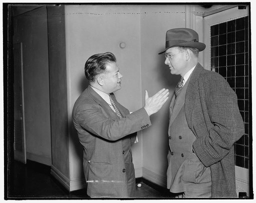 C.I.O. leaders. Washington, D.C., Oct. 27. David Dubinsky, (left) President of the Ladies Garment Workers Union and Homer Martin, President of the United Automobile Workers, snapped as they chatted following the recess of the peace meeting between the CIO and AF of L. The labor factions will not res