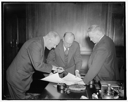 New first Assistant to PWA administrator. Washington, D.C., Nov. 1. Howard A. Gray, of Chicago, enter former Director of Housing for PWA today was sworn in as Assistant Administrator of Public Works. Floyd Dodson, Chief Clerk of the Interior is on the left, Sec. of the Interior Harold Ickes on the r